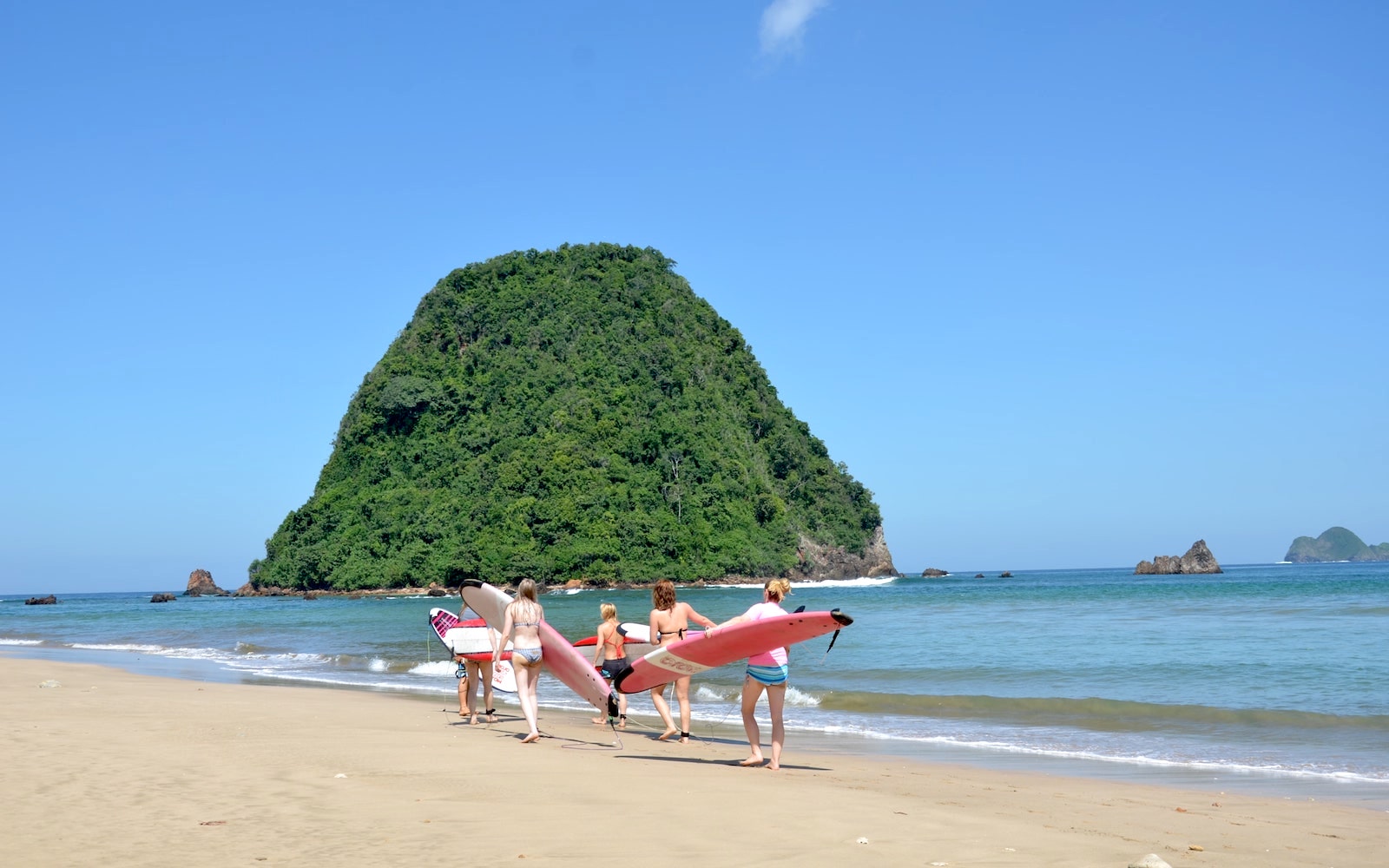 Surfing at remote island escape at Red Island, Java