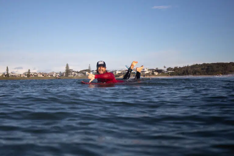Surf lesson in the water with a Mojosurf instructor