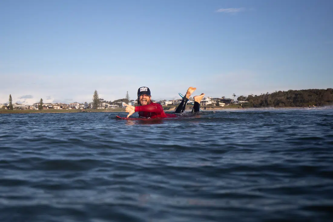 Surf lesson in the water with a Mojosurf instructor