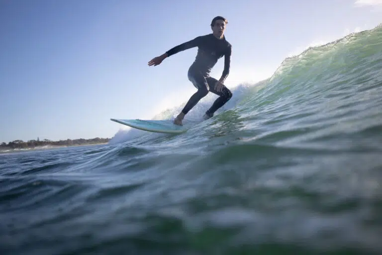Surf Academy student riding a wave
