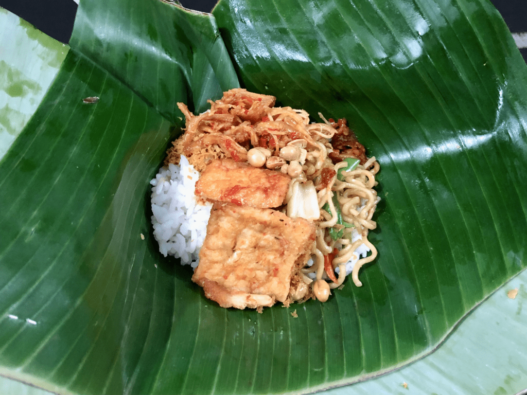 Local Indonesian dish Nasi Jinggo. Portion of rice packed in a banana leaf.