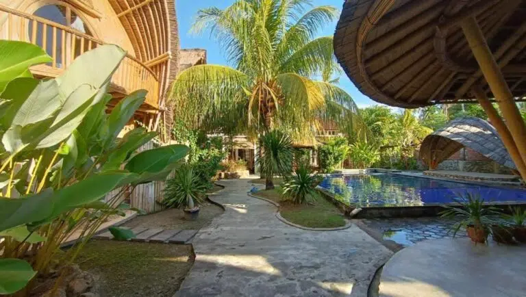 Tropical garden and pool at the Mojosurf camp in Lombok