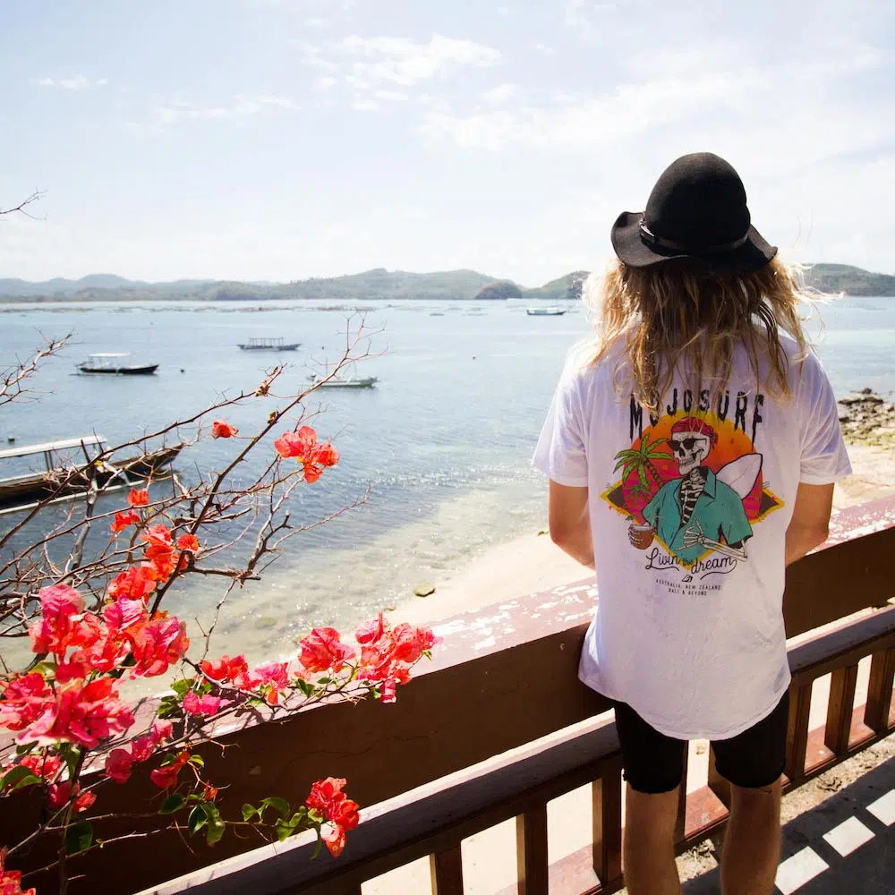 Guest looking out to sea from a balcony in Bali