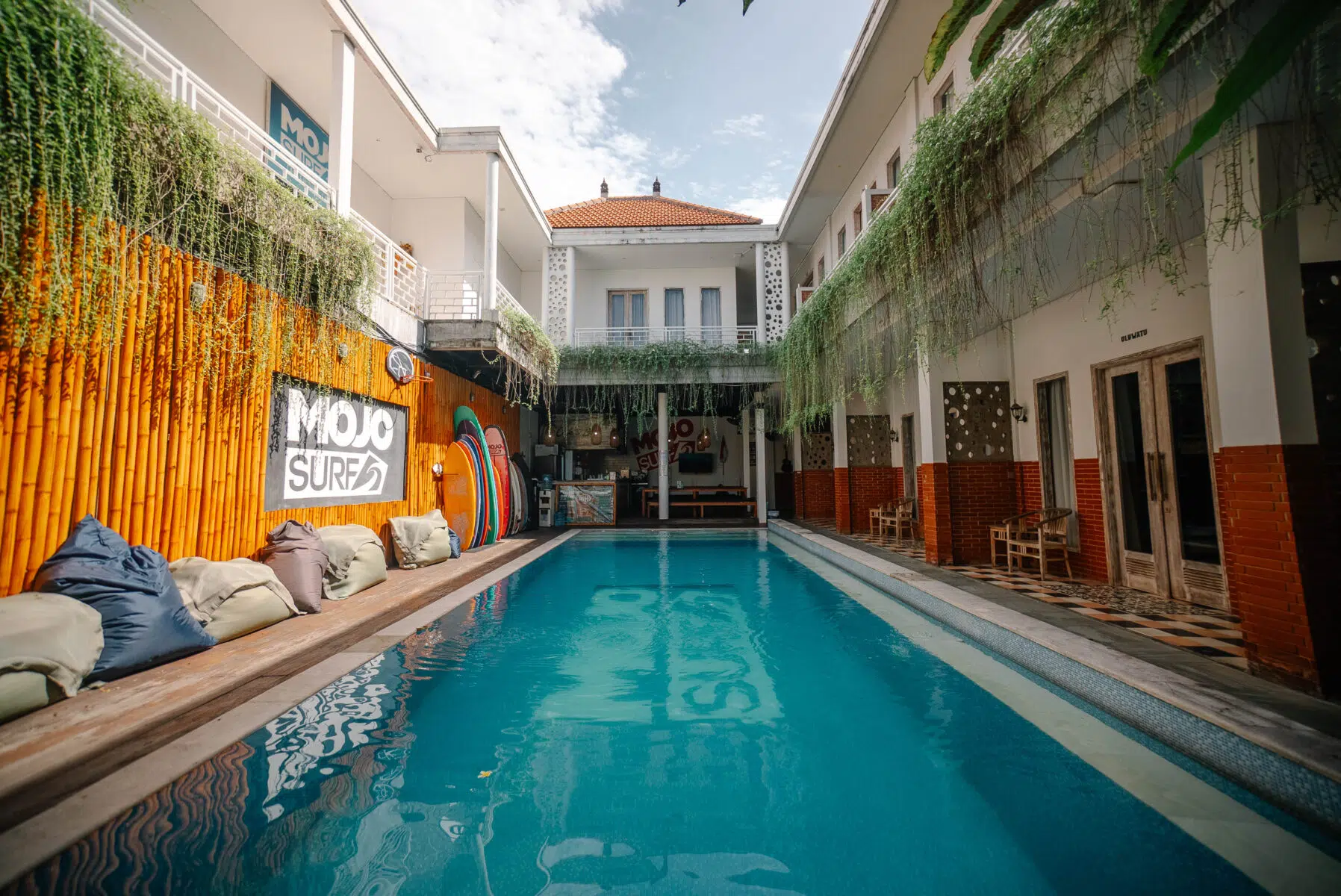 Pool and loungers at the Mojosurf camp in Canggu