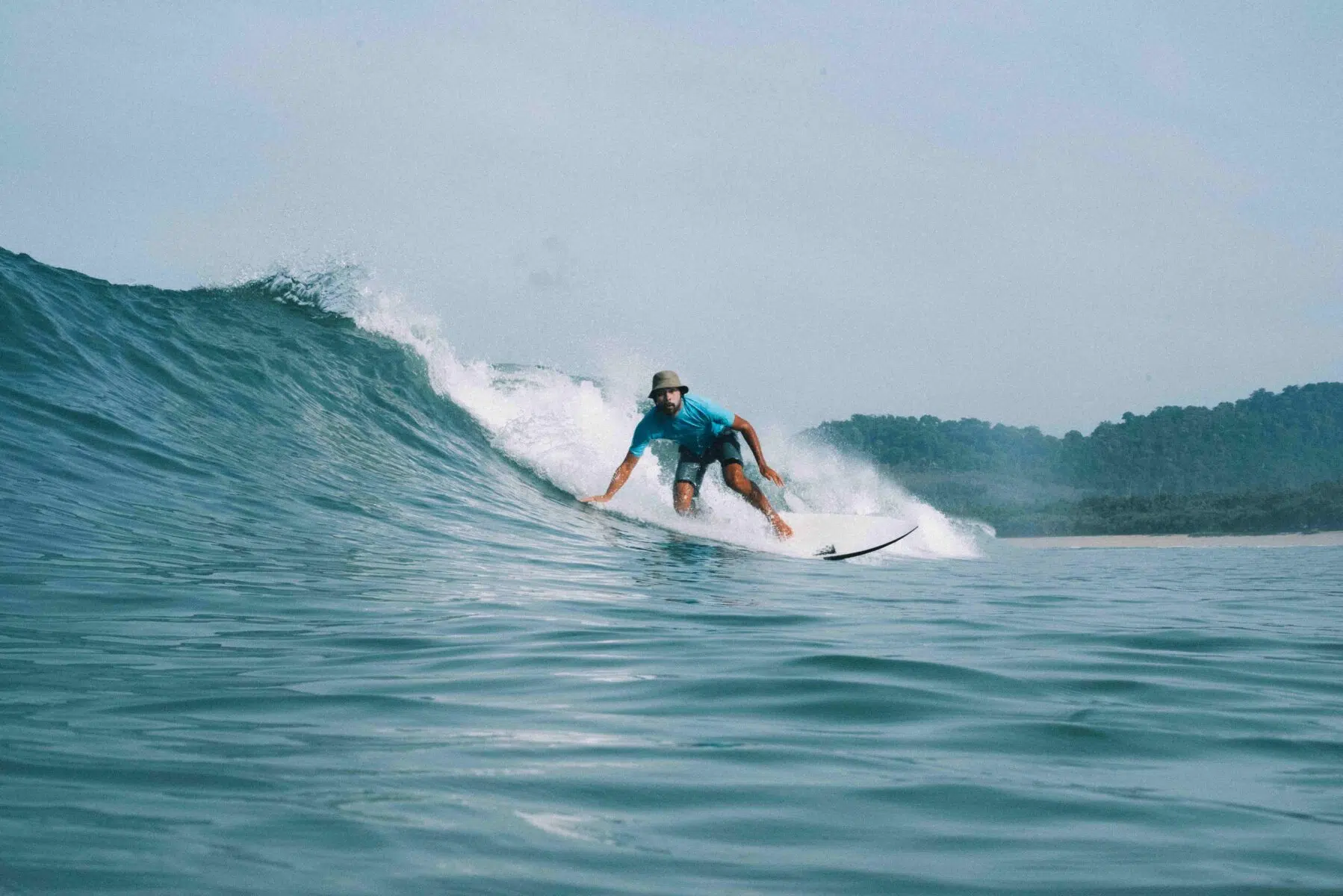 Surfer riding a big wave at Nusa Lembongan