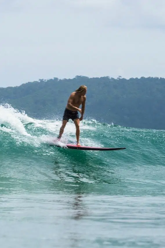 Surfer riding a wave in Lombok