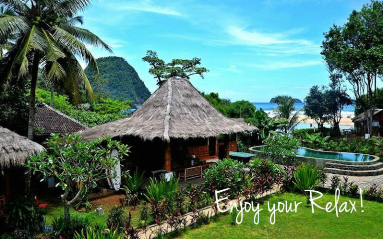 Thatched bungalow at the Mojosurf camp on Red Island, Java