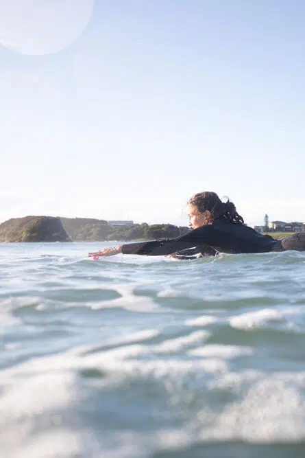 Surfer paddling out at Spot X