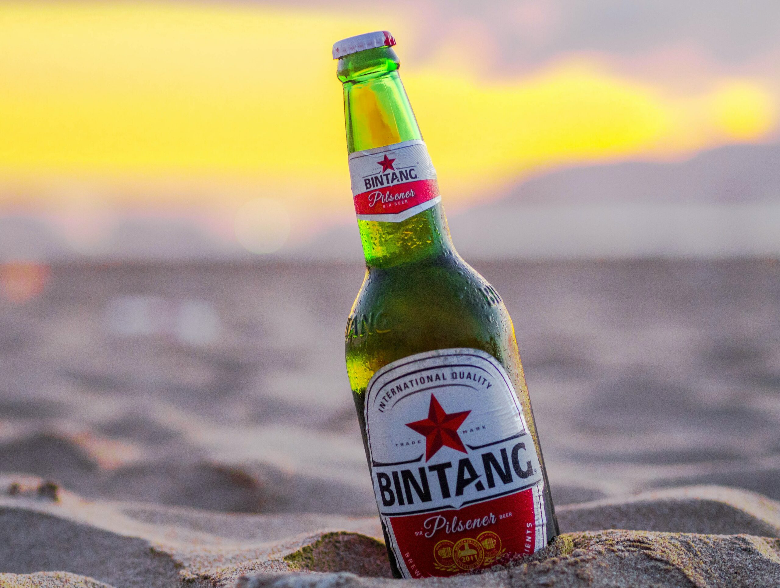 Bottle of Bintang beer on the beach.