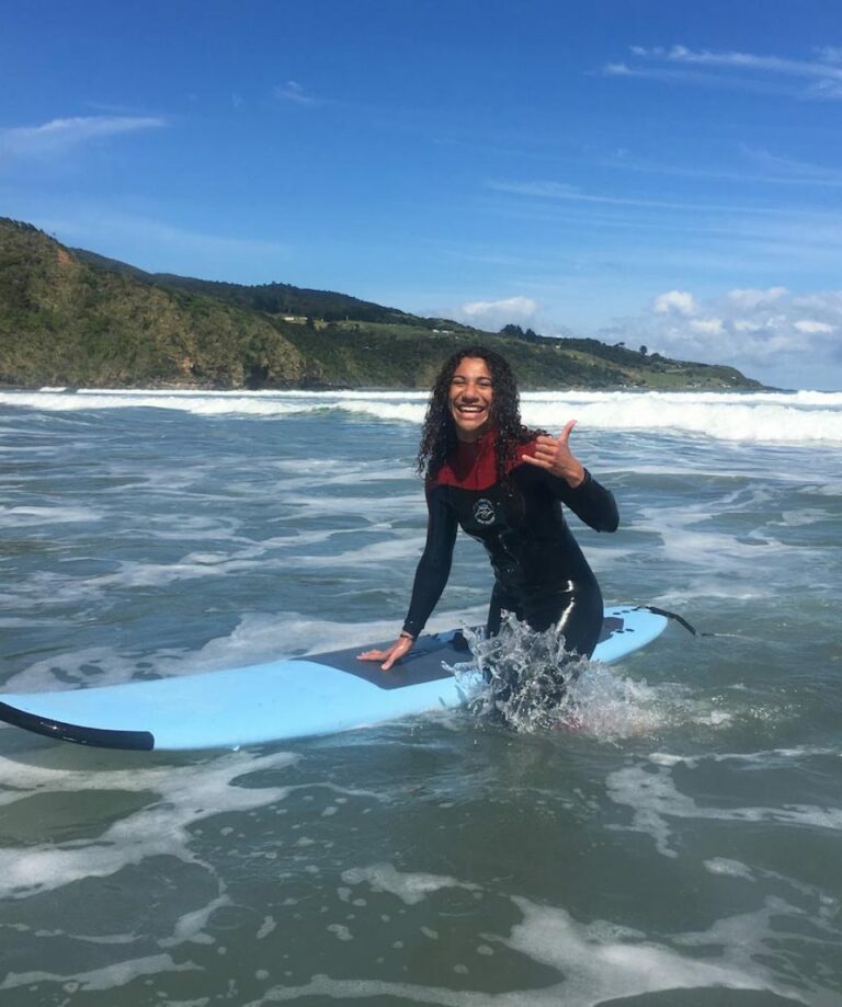 Learner surfer standing up in the whitewash