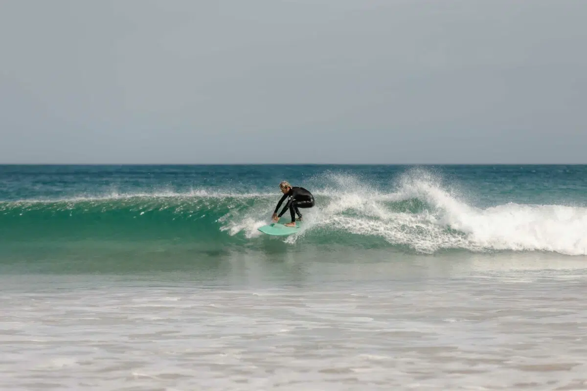 Surfer riding a wave in Peniche, Portugal