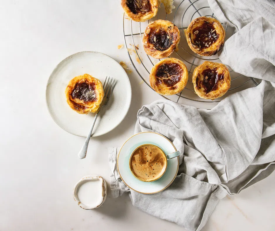 Pasteis de nata and coffee on a table