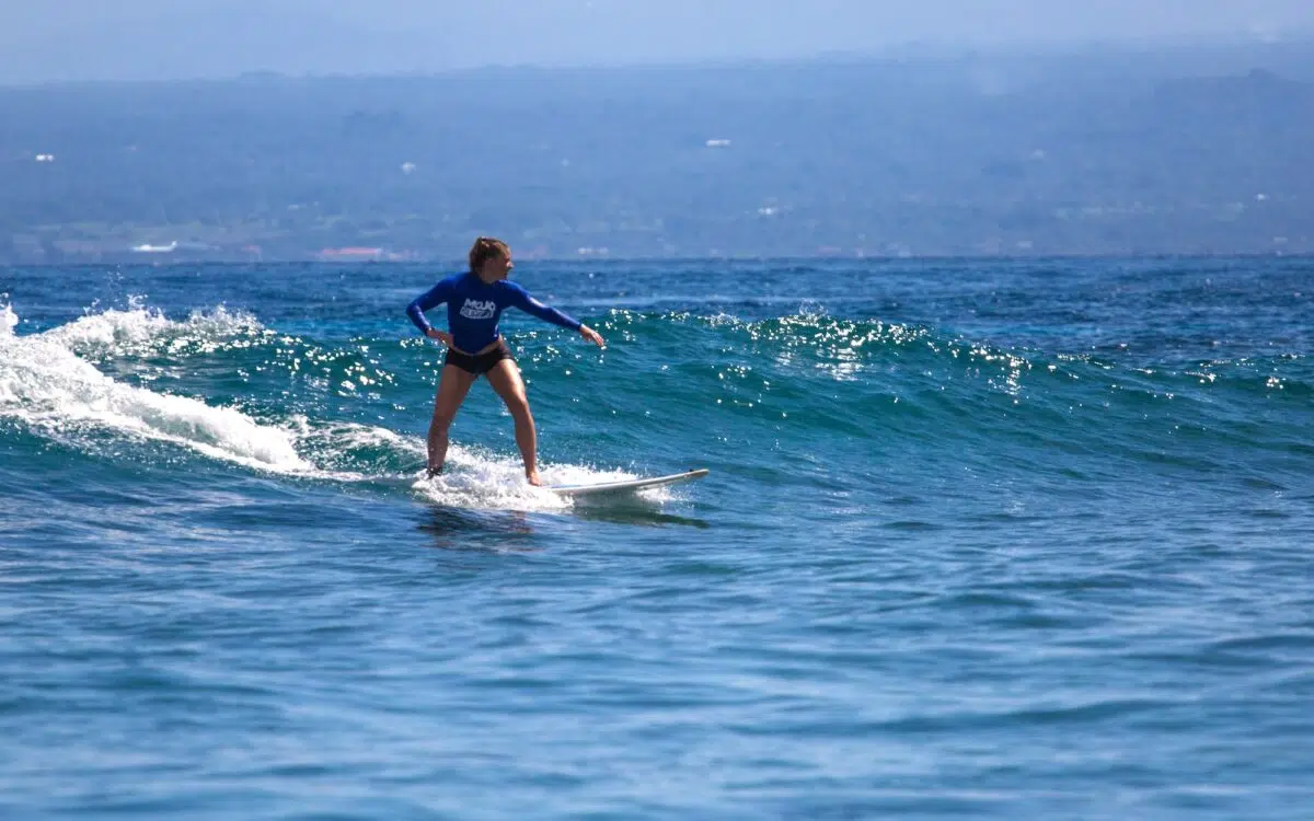 Surfer riding a wave at Nusa Lembongan