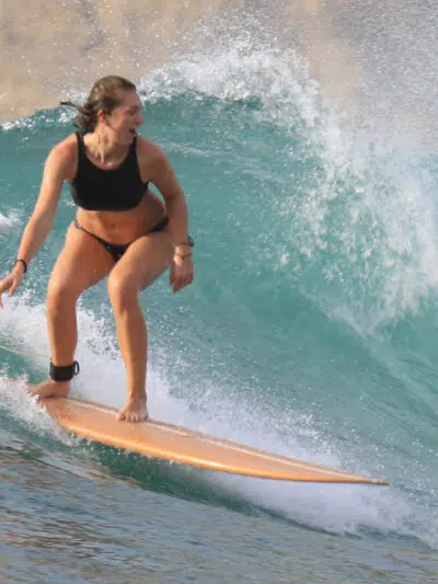Surfer riding a wave in Lombok